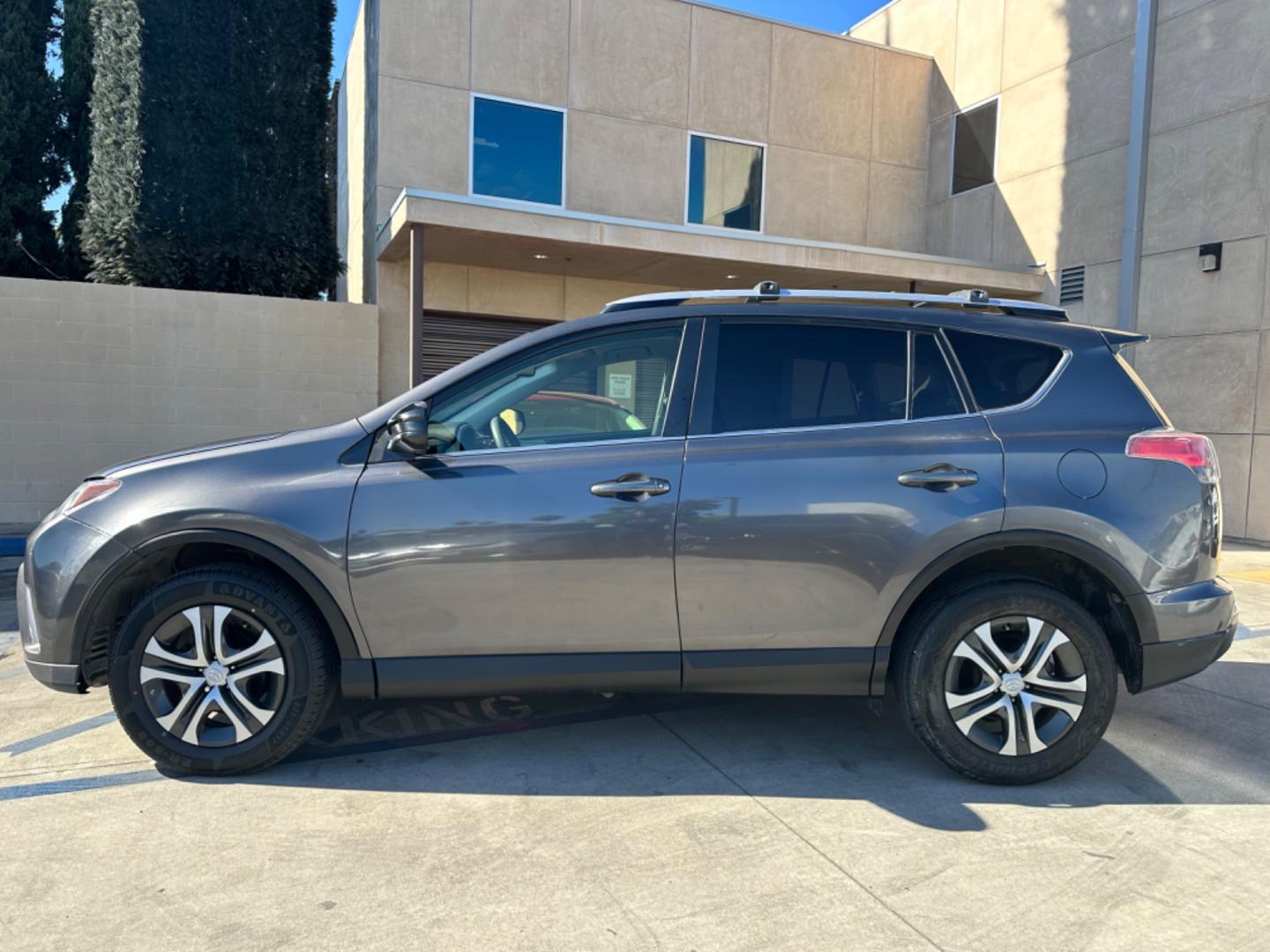 2016 Gray /Black Toyota RAV4 (JTMZFREVXGJ) , AUTOMATIC transmission, located at 30 S. Berkeley Avenue, Pasadena, CA, 91107, (626) 248-7567, 34.145447, -118.109398 - Crown City Motors is a used “Buy Here Pay Here” car dealer in Pasadena CA. “Buy Here Pay Here” financing, means that when you purchase your vehicle from our dealership, that you make the payments to the dealership as well. We do not need the banks approval to get you approved for a used auto - Photo#1